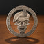 A circular silver-toned metal challenge coin featuring a skull wearing a beret, with the engraved text 'Death Smiles At Everdone' and 'Army Smiles Back' around the border, standing on a wooden surface against a dark background.