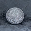 Close-up of a coin engraved with a coiled serpent encircled by a rope ring, two kneeling figures on either side, ornate crown detail above, E Pluribus Unum outer border