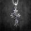 snake wrapped cross pendant front view — serpent head resting at center cross with oxidized dark metal finish