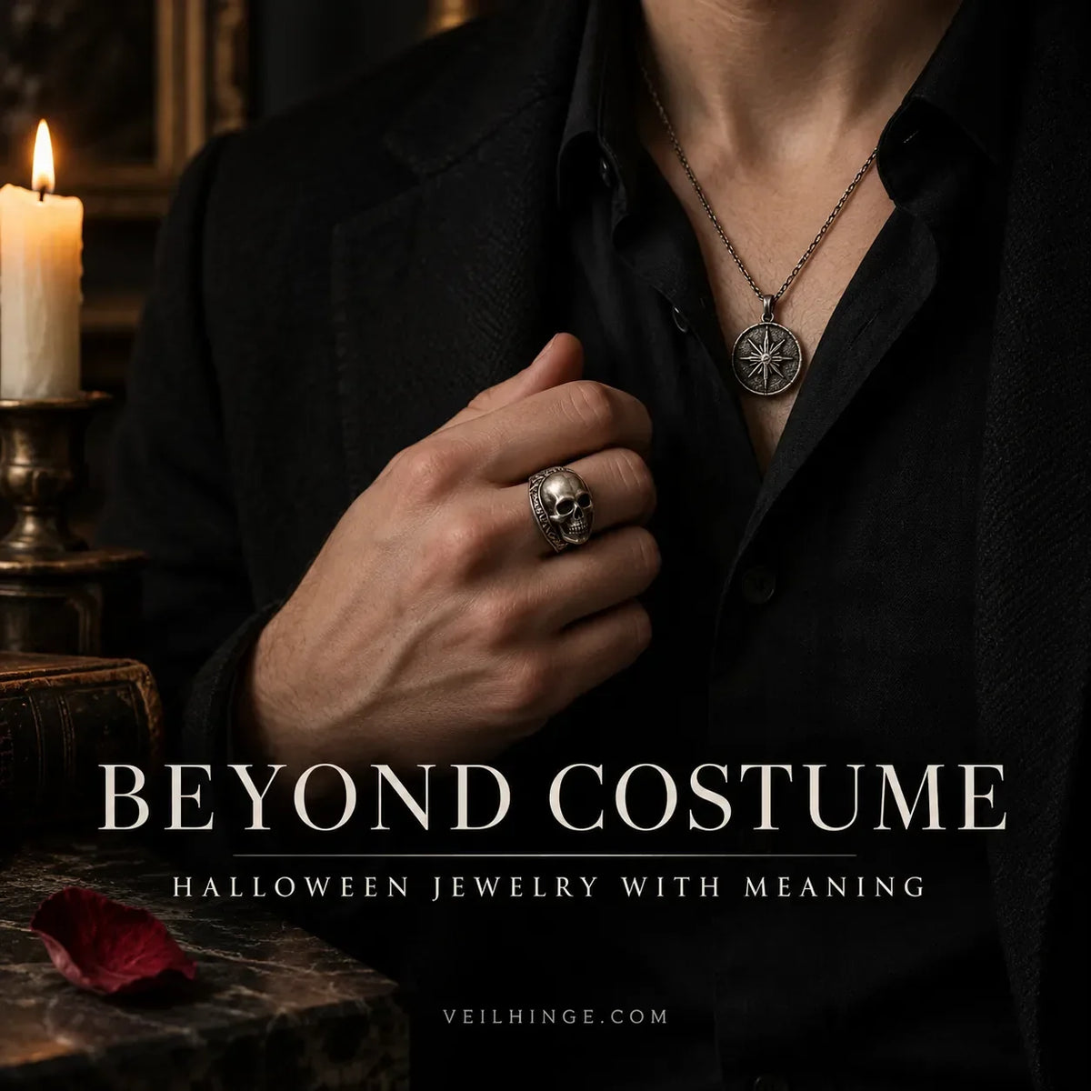 Skull ring and symbolic pendant styled with restrained black clothing as wearable Halloween jewelry.