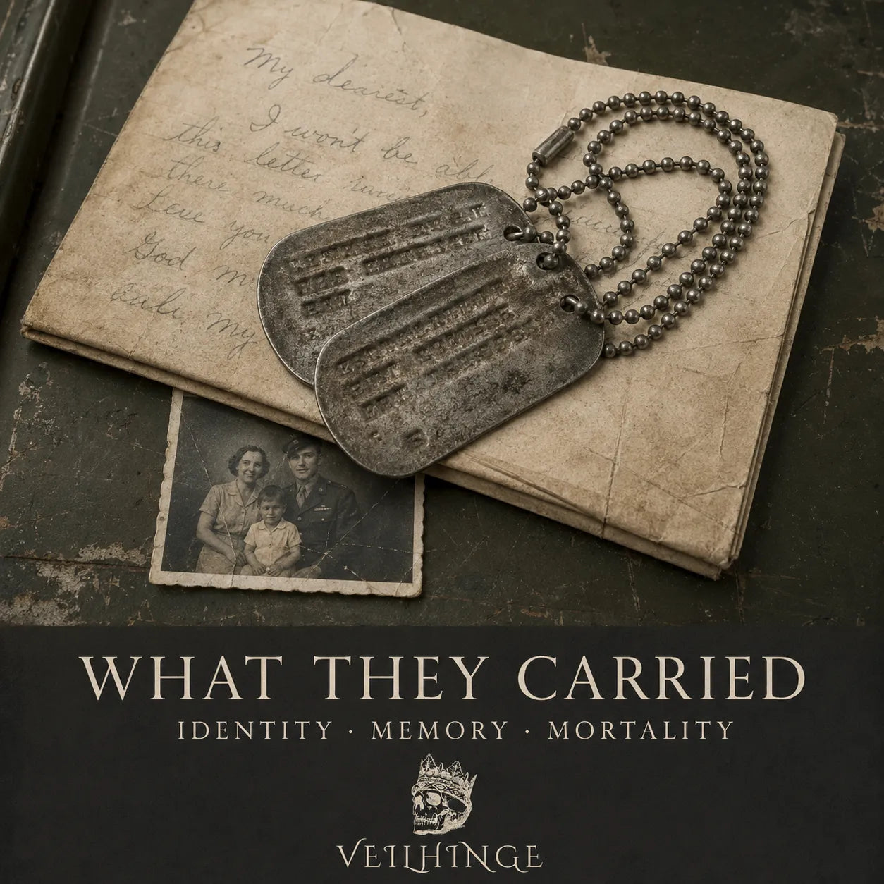 Worn military dog tags resting on an unopened handwritten letter and an old family photograph.