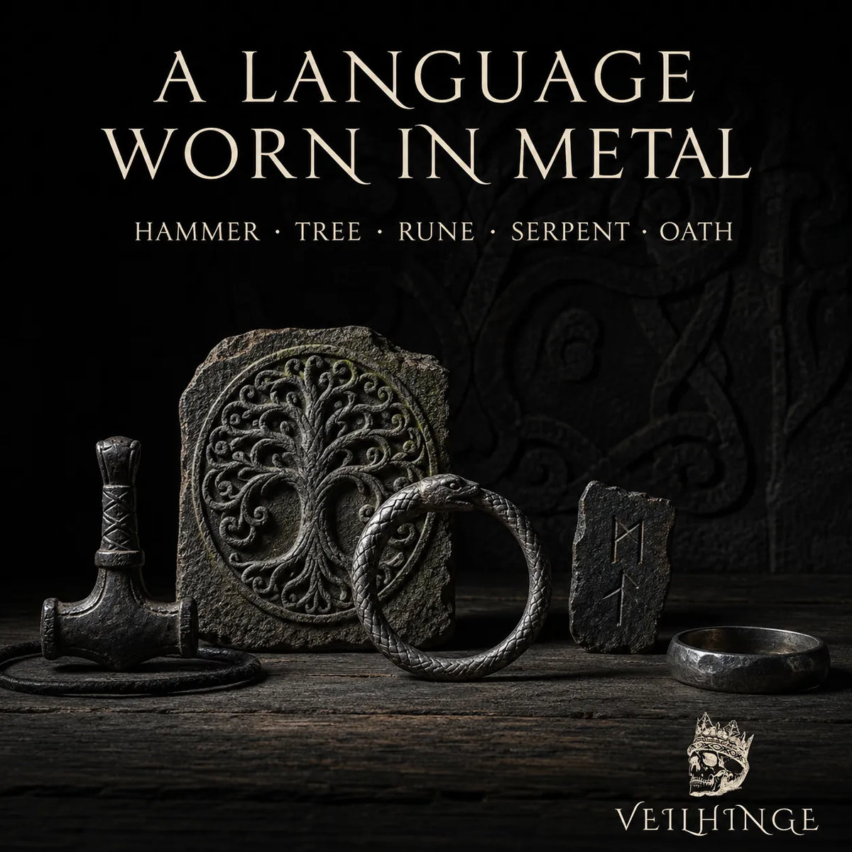 Yggdrasil stone carving displayed with a Mjölnir pendant, serpent oath ring, rune fragment and darkened metal band.