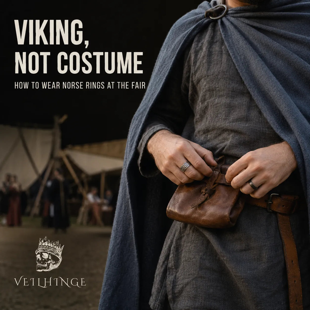 Renaissance fair attendee wearing oxidized Norse rings while fastening a leather belt pouch over a linen tunic and wool cloak.