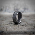 Minimalist black band ring with sandblasted oxidized matte surface and polished silver rim in stainless steel, dark aesthetic plain band ring by Veilhinge, side view