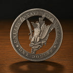 A detailed silver-colored United States one dollar coin standing upright on a polished wooden surface against a dark background.