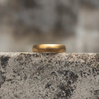 Antique gold-tone plain band ring shown from the front