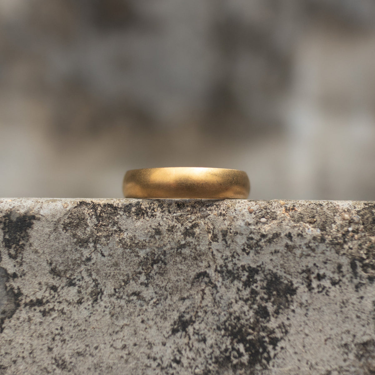 Antique gold-tone plain band ring shown from the front