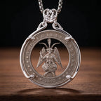 Silver cutout coin pendant necklace featuring an engraved Baphomet figure with wings and torch, inscribed "E Pluribus Unum 1893" in a hobo nickel style