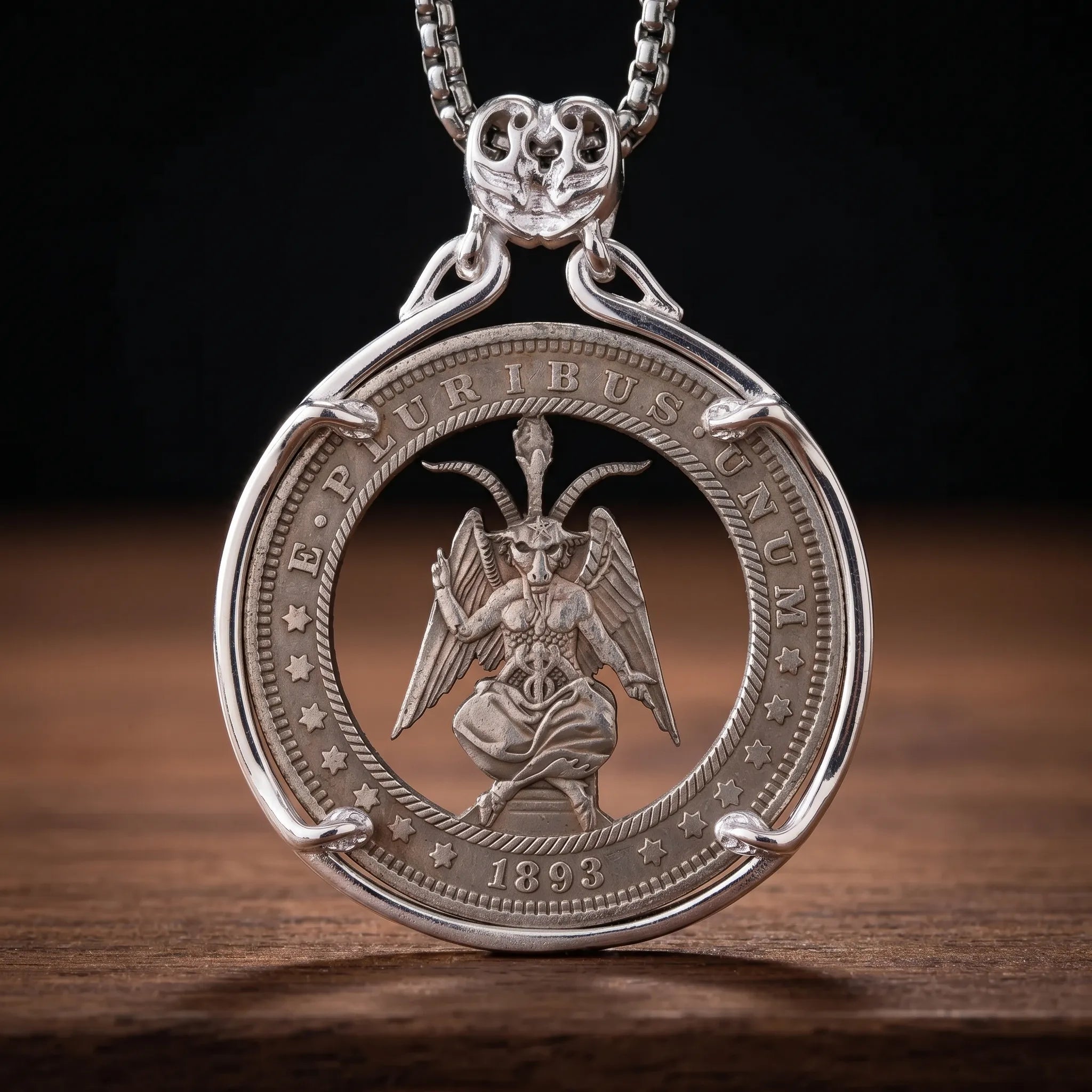 Silver cutout coin pendant necklace featuring an engraved Baphomet figure with wings and torch, inscribed "E Pluribus Unum 1893" in a hobo nickel style