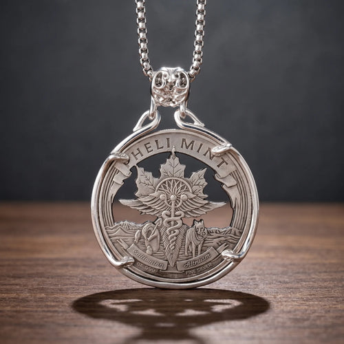 caduceus wolf coin pendant necklace — winged caduceus with double serpents, wolf and maple leaf landscape, Cultivating Altruism banner inscription, four-prong open frame, ornate skull bail, antique silver tone, dark wood surface