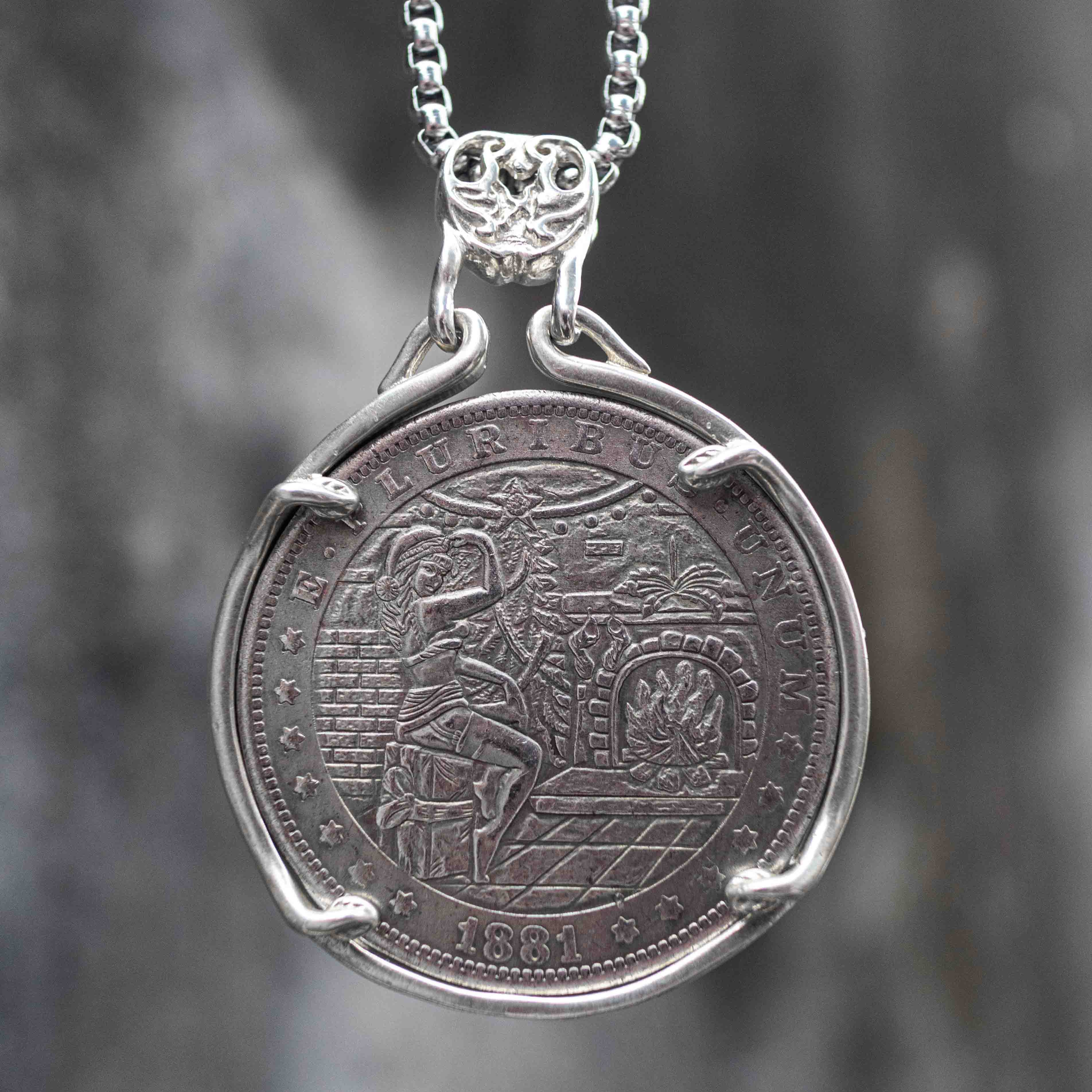 Coin pendant engraved with a festive woman in a Christmas hat beside a decorated tree and fireplace, diamond floor pattern, dated 1881, set in a four-prong bezel on a chain Main image