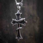 gothic cross pendant reverse side — smooth oxidized dark metal back with flared cross arms and box chain bail