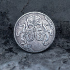 Coin pendant engraved with a skull merging into octopus tentacles spreading across the coin face, Liberty inscription, dated 1937, set in a four-prong bezel on a chain
