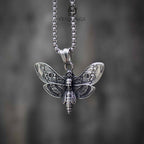 Death's head moth skull pendant necklace front view, engraved wing detail with skull body, oxidized silver, dark aesthetic gothic jewelry
