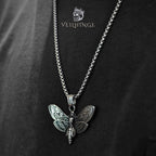 Death's head moth skull pendant necklace worn on model with black outfit, oxidized silver gothic statement necklace, dark aesthetic jewelry
