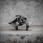 Demon eye articulated ring with closed fang jaw in oxidized black stainless steel, gothic dark aesthetic mechanical statement ring by Veilhinge, front view — fangs closed, eye concealed