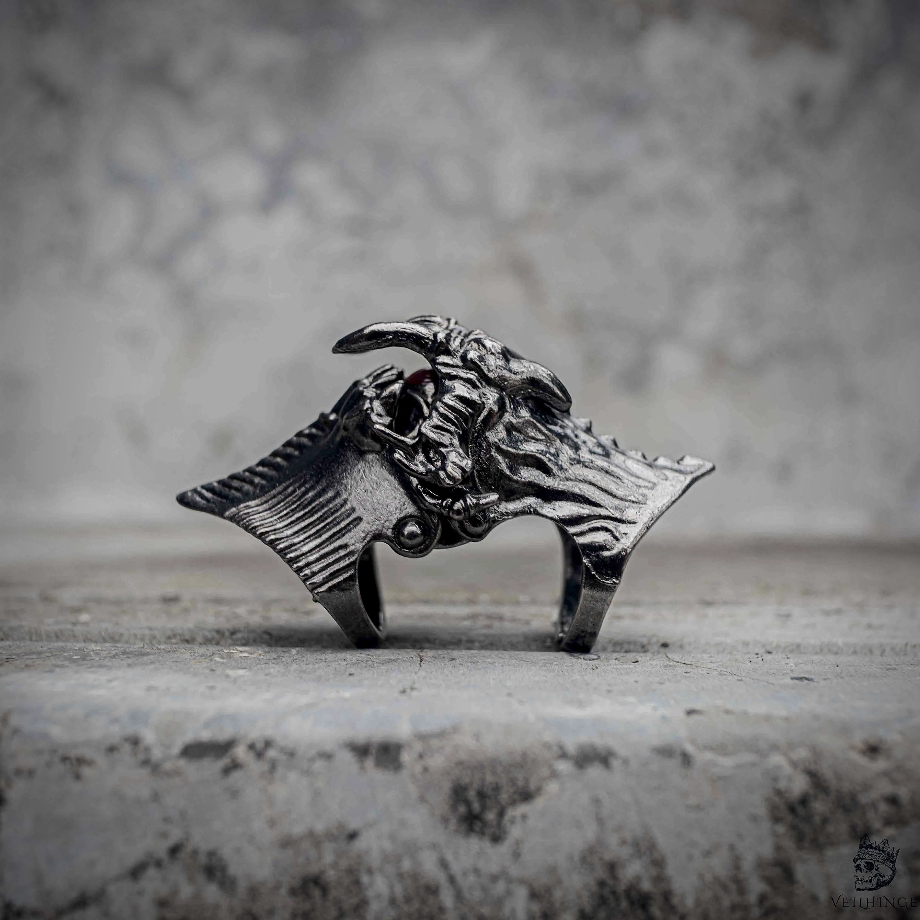 Demon eye articulated ring with closed fang jaw in oxidized black stainless steel, gothic dark aesthetic mechanical statement ring by Veilhinge, front view — fangs closed, eye concealed