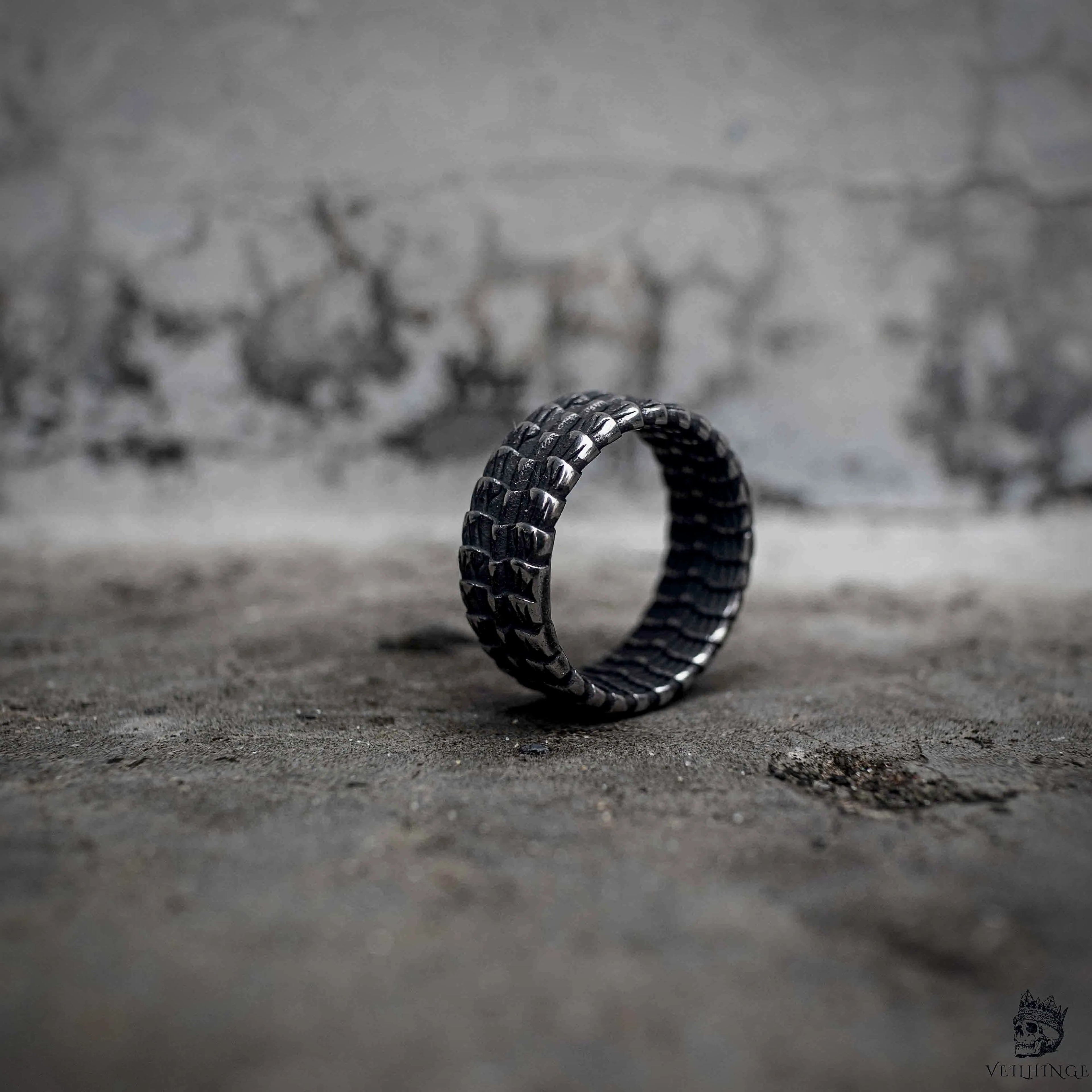 Gothic dragon scale wide band ring upright view showing full texture, oxidized black stainless steel dark aesthetic jewelry by Veilhinge