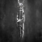 eagle claw bullet pendant necklace — polished silver bullet gripped by eagle talons, full chain view on dark background