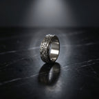 rotating stainless steel ring with dark eye motif detail