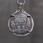 Double-sided book lover coin pendant showing the Go To Bed side with counting sheep jumping over a moonlit hill, set in a four-prong bezel on a box chain