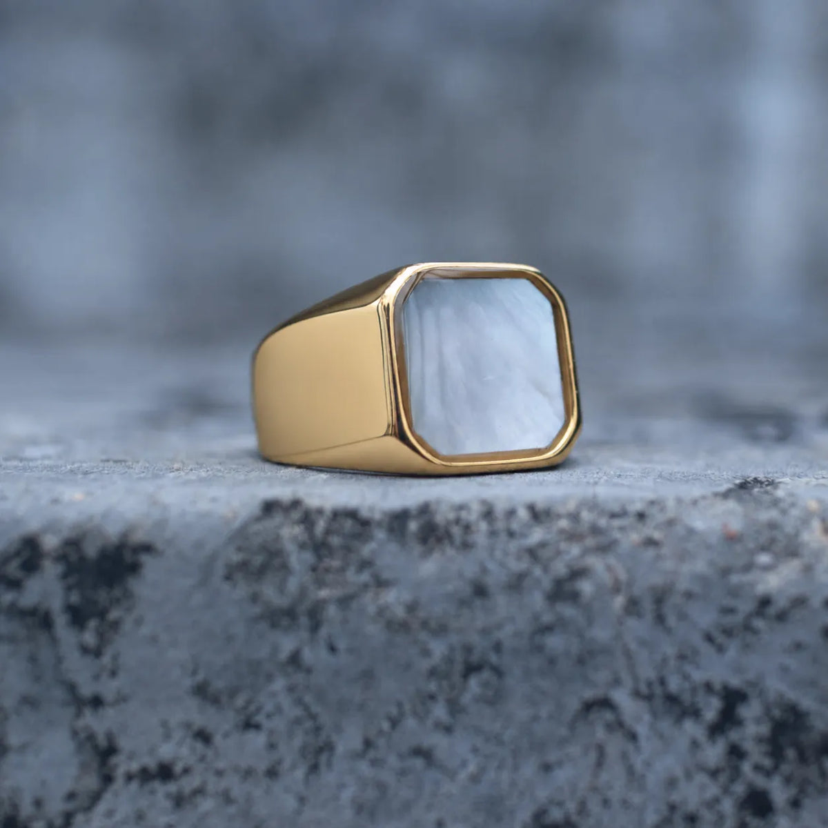 Gold-tone square signet ring with a white mother-of-pearl face, front view Main image