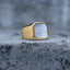 Gold-tone square signet ring with a white mother-of-pearl face, front view