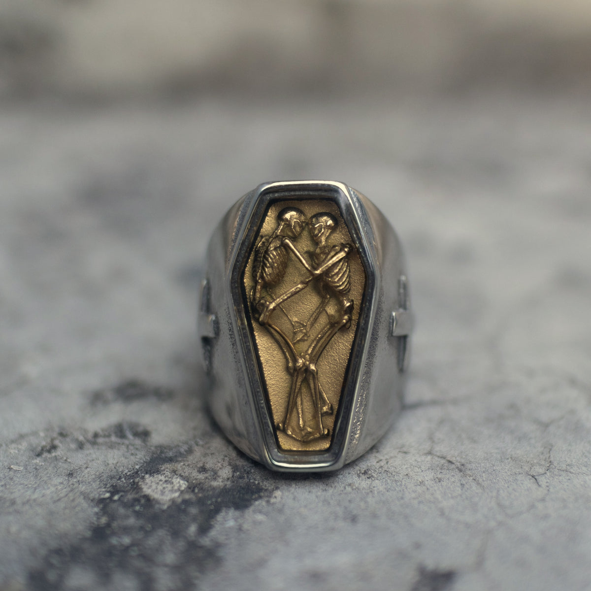 Coffin-shaped signet ring with a gold-plated skeleton relief sealed beneath clear resin Main image