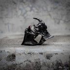 Demon eye articulated ring with open fang jaw revealing hidden eye in oxidized black stainless steel, gothic mechanical ring by Veilhinge, side view — fangs open, eye revealed
