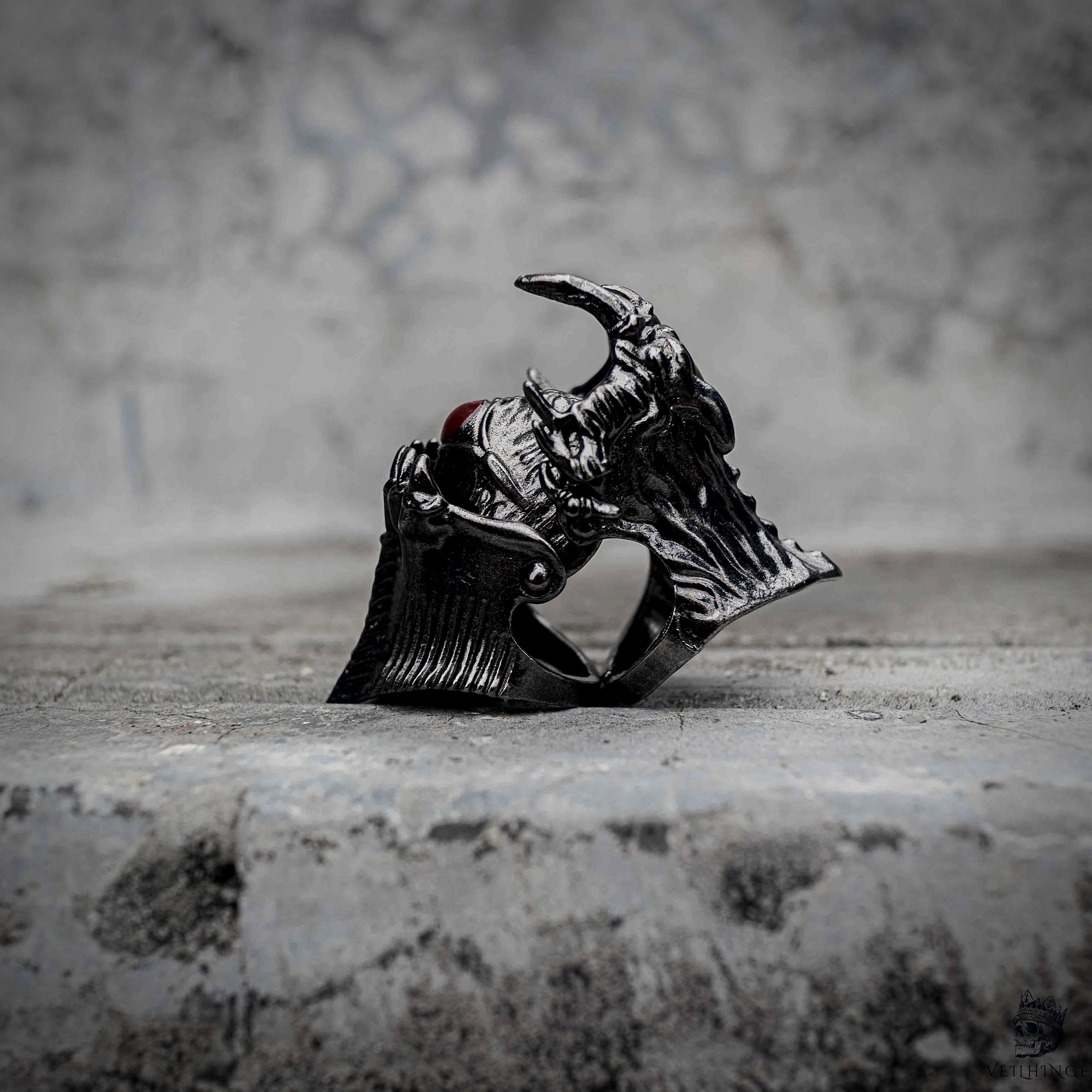 Demon eye articulated ring with open fang jaw revealing hidden eye in oxidized black stainless steel, gothic mechanical ring by Veilhinge, side view — fangs open, eye revealed
