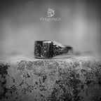 Rectangular curved signet ring face with gothic floral scroll motif — oxidized silver, raised engraving on beveled face, dark aesthetic