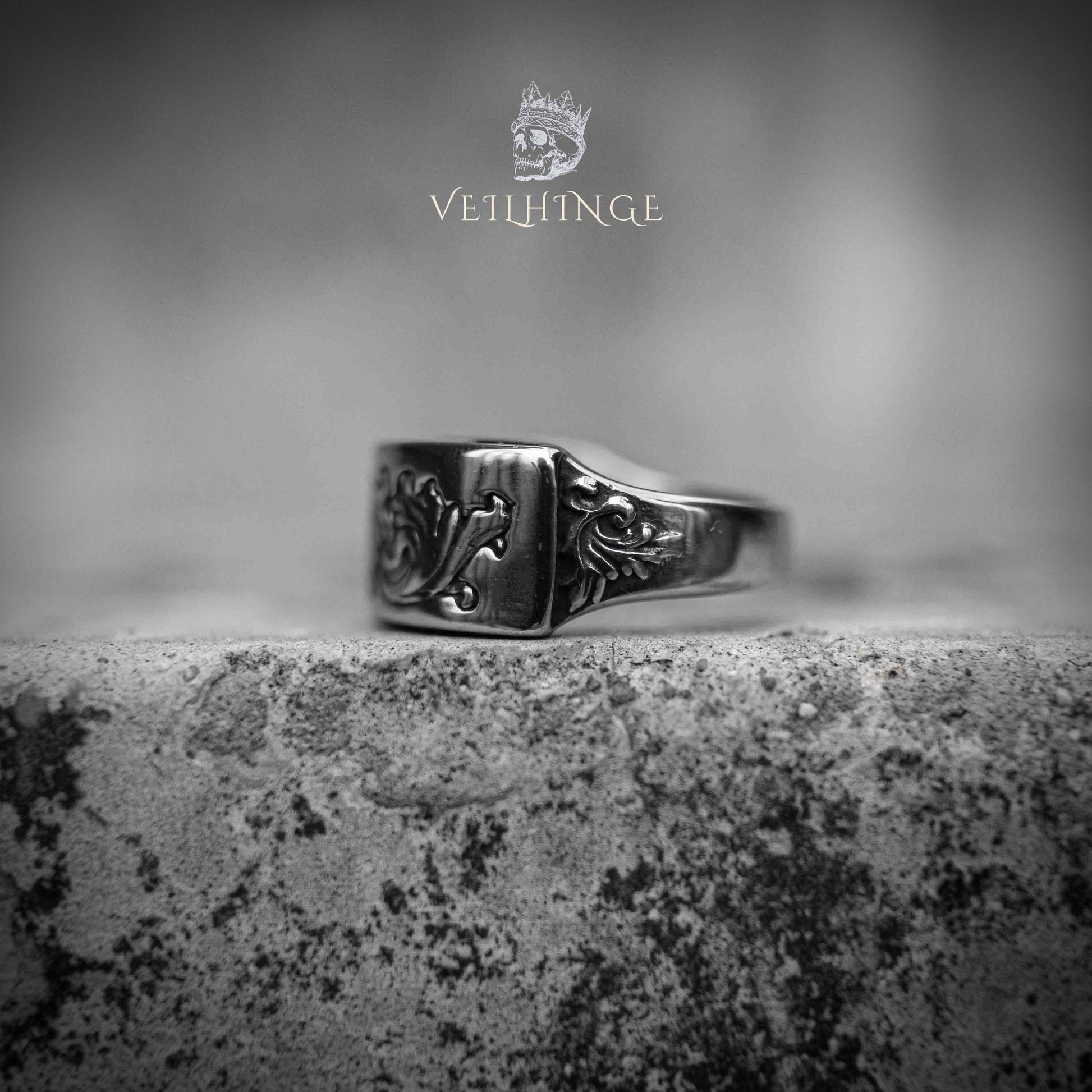 Rectangular curved signet ring face with gothic floral scroll motif — oxidized silver, raised engraving on beveled face, dark aesthetic