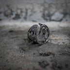 Gothic wide band ring with openwork cutout design in polished stainless steel, dark aesthetic jewelry, angled back view, Veilhinge