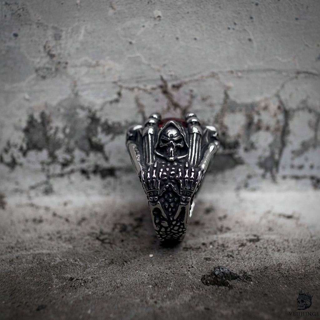 Gothic grim reaper dragon claw ring side view showing skull reaper engraving with red stone, dark aesthetic oxidized stainless steel ring by Veilhinge