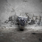 Gothic grim reaper ring with triangle face showing scythe and cross engraving, polished stainless steel, dark aesthetic memento mori ring by Veilhinge, front view