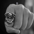 Live to Ride skull ring with V-twin engine body worn on a clenched fist, shot in black and white
