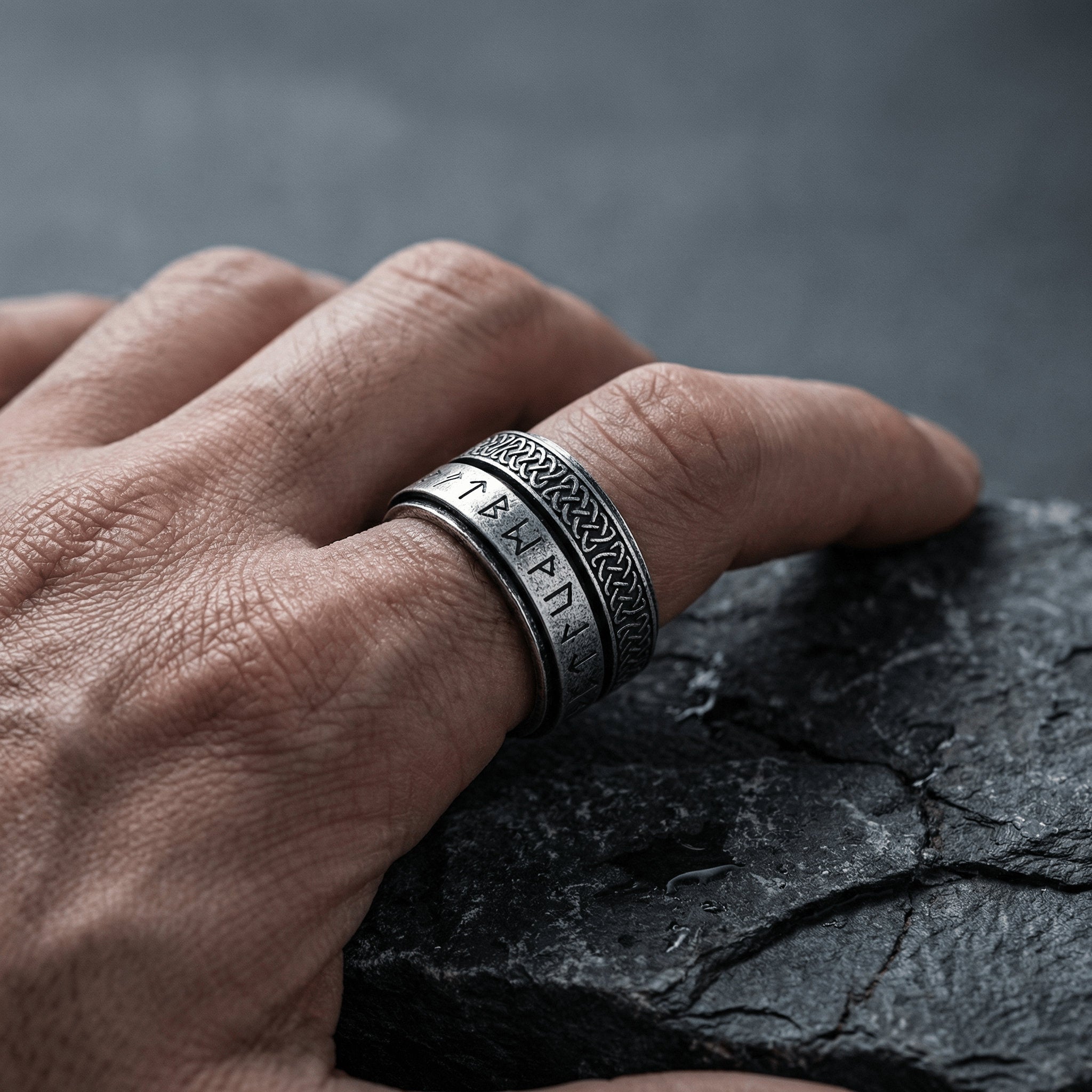 men wearing rune spinner ring stainless steel rotating band lifestyle shot