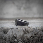 Black signet ring interior view showing sandblasted oxidized stainless steel band and matte dark finish throughout, minimalist dark aesthetic ring by Veilhinge