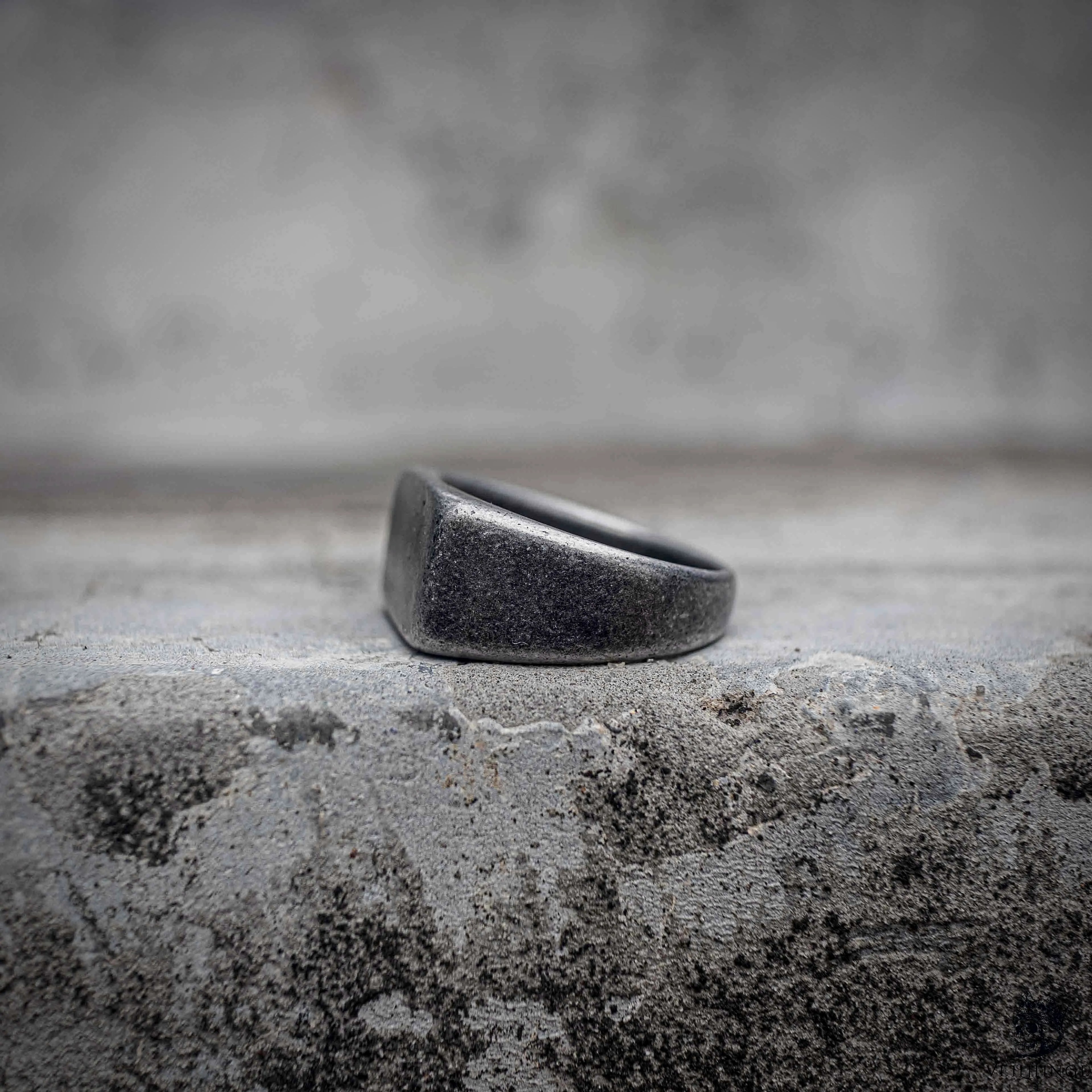 Black signet ring interior view showing sandblasted oxidized stainless steel band and matte dark finish throughout, minimalist dark aesthetic ring by Veilhinge