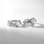 Two silver organic moonstone rings shown from multiple angles on clean white background, highlighting intricate tentacle design