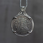 Viking coin art pendant flipped to the Morgan Dollar eagle reverse, held in a four-prong bezel with skull bail on a box chain