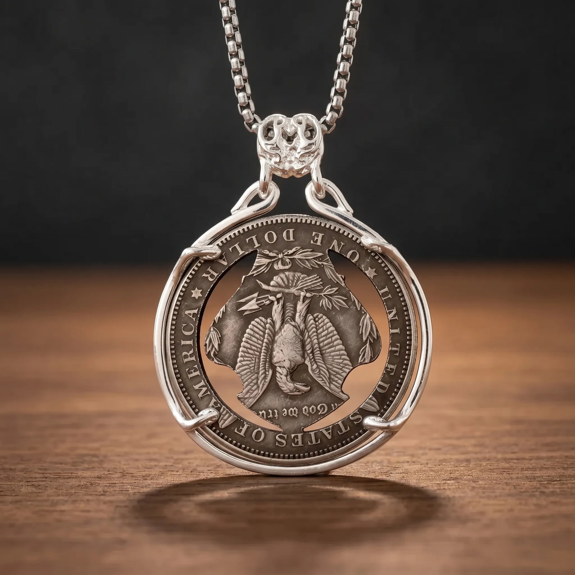 biker skull coin pendant necklace reverse — american eagle coin face, United States of America inscription, antique silver tone, dark wood surface