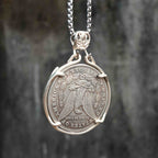 All-seeing eye coin pendant reversed to show the Morgan Dollar eagle with United States of America and One Dollar inscription, in a four-prong open bezel on a chain