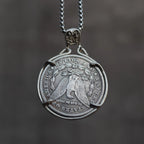 Coin pendant reversed to show the Morgan Dollar eagle face with One Dollar inscription, suspended from a skull bail on a box chain