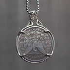 Danse Macabre skeleton couple coin pendant reversed to show the Morgan Dollar eagle with United States of America and One Dollar inscription, in a four-prong open bezel