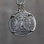 Eye of Providence coin pendant reversed to show the Morgan Dollar eagle with One Dollar inscription, held in a four-prong open bezel
