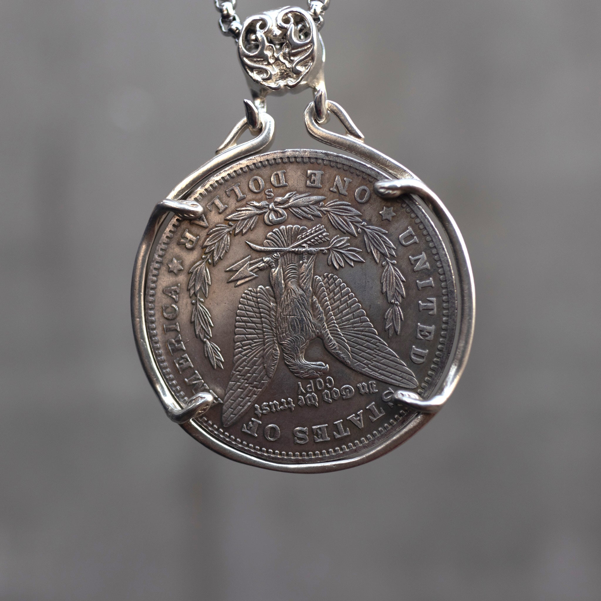 Moon goddess coin pendant reversed to show the Morgan Dollar eagle with One Dollar inscription, held in a four-prong open bezel on a chain