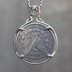 Skeleton pirate captain coin pendant reversed to show the Morgan Dollar eagle with One Dollar inscription, held in a four-prong open bezel on a box chain