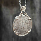 Skeleton gambler coin pendant reversed to show the Morgan Dollar eagle with United States of America and One Dollar inscription, in a four-prong open bezel