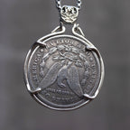 Skull chief coin pendant reversed to show the Morgan Dollar eagle with United States of America and One Dollar inscription, in a four-prong open bezel on a chain